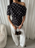 Polka dott draped one shoulder top in black