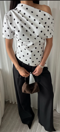 Polka dott draped one shoulder top in white