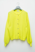A neon yellow cardigan sweater hanging on a gray hanger against a plain white wall, featuring a round neckline, front button closure, and balloon sleeves.