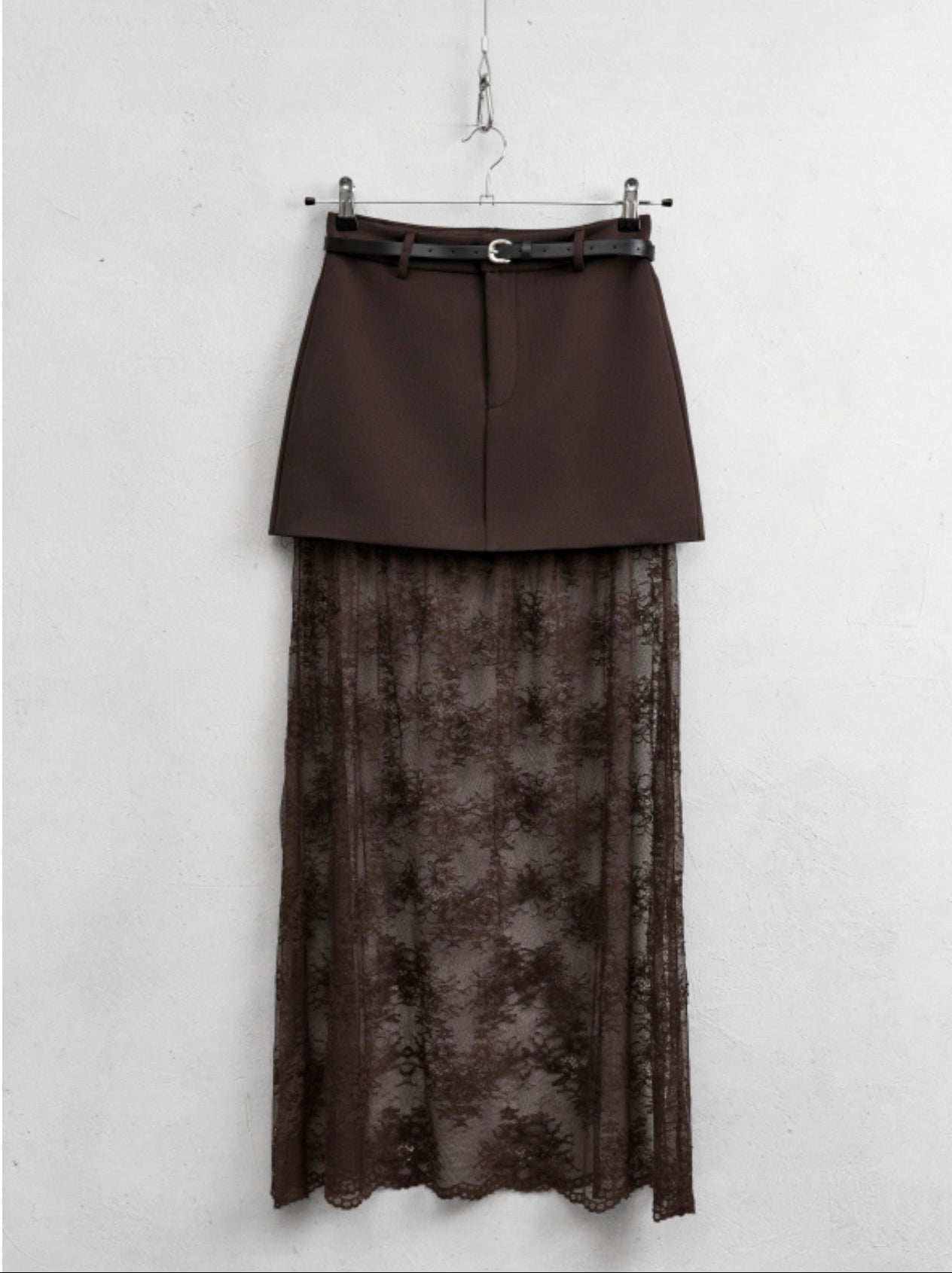 Two-layered skirt with a belt on a white background