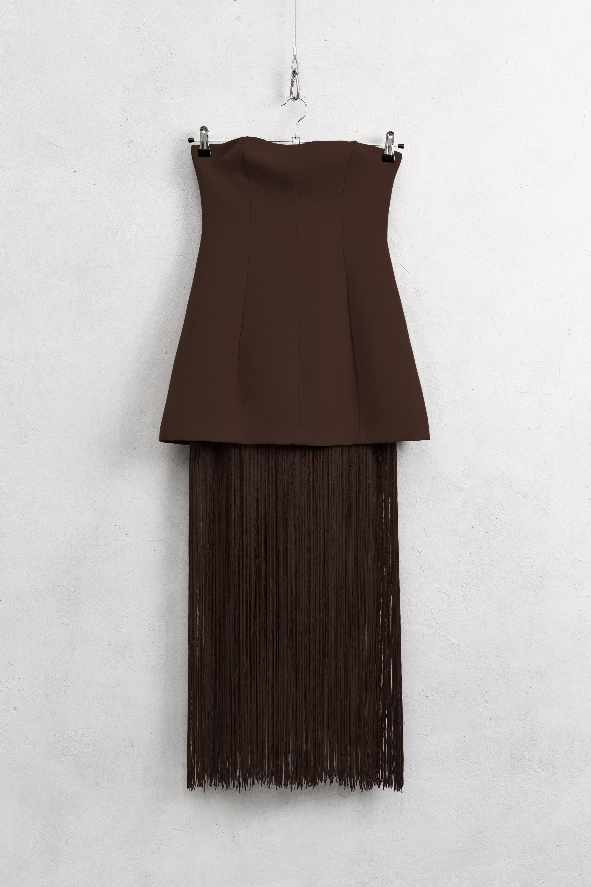 Brown dress with a sheer overlay on a white background